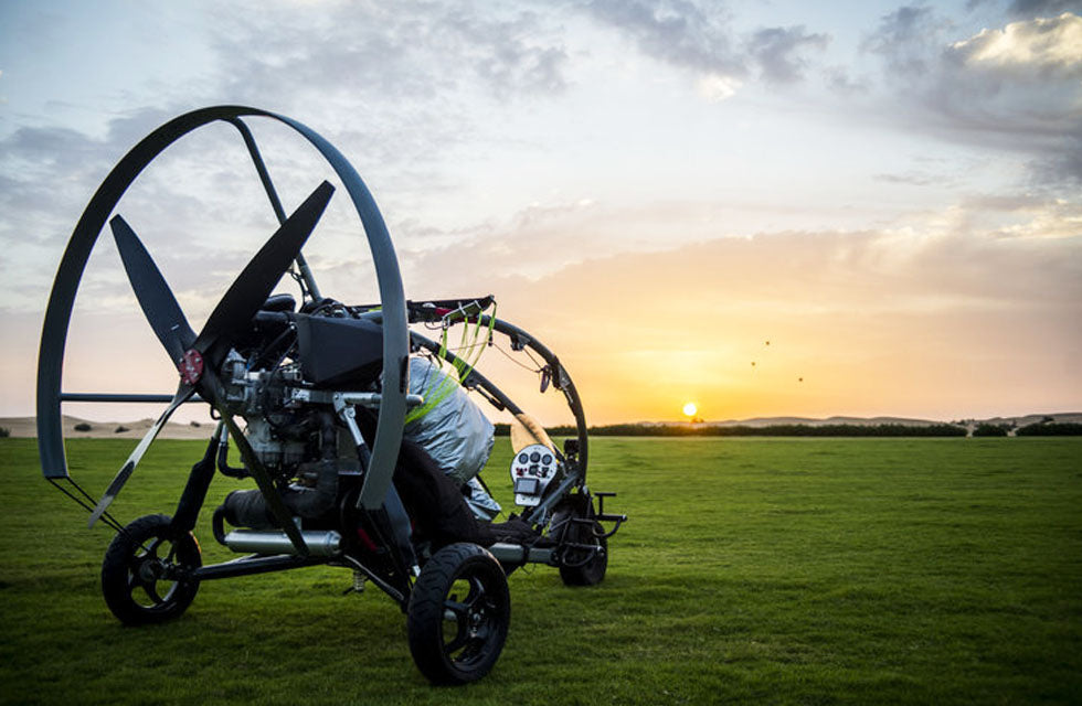 Fly Over Dubai's Sand Dunes with 20-Minute Paramotor Adventure - Transfer Included
