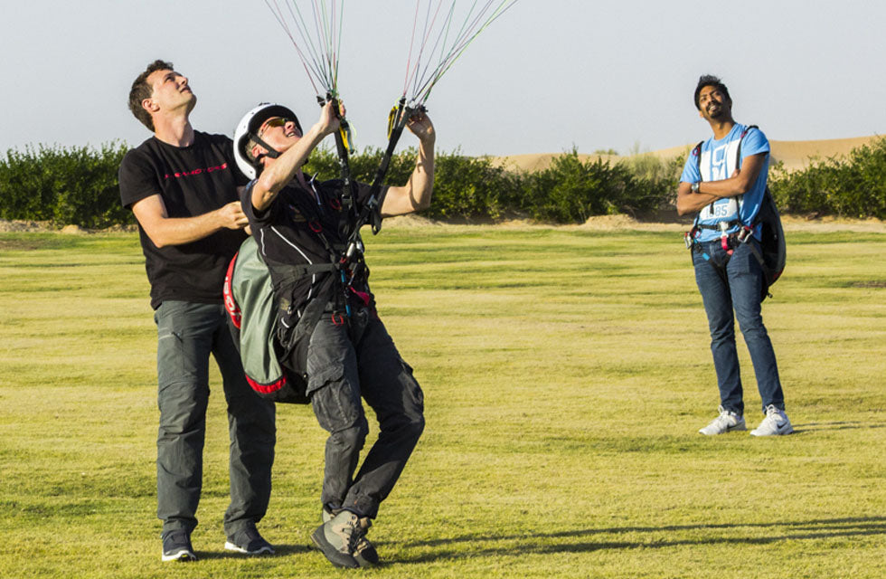 Fly Over Dubai's Sand Dunes with 20-Minute Paramotor Adventure - Transfer Included
